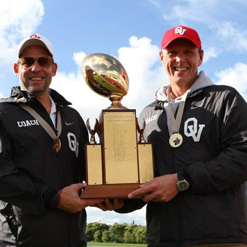 Oslo Vikings coaches celebrate with a trophy